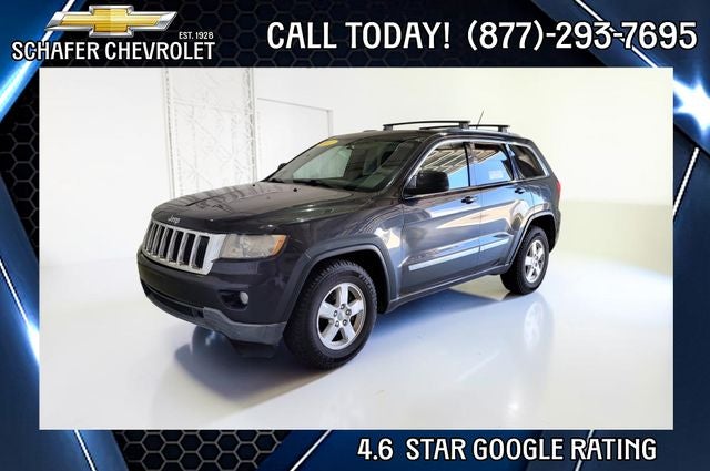 2011 Jeep Grand Cherokee Laredo in Dark Charcoal Pearlcoat — front three-quarter view